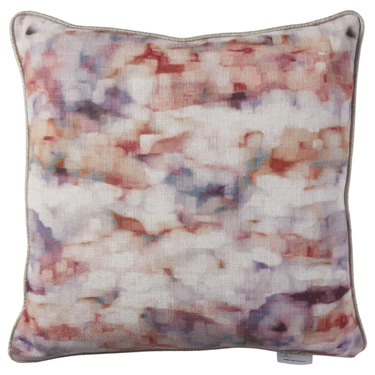 A multicolored pillow or cushion in red, purple, white and pink